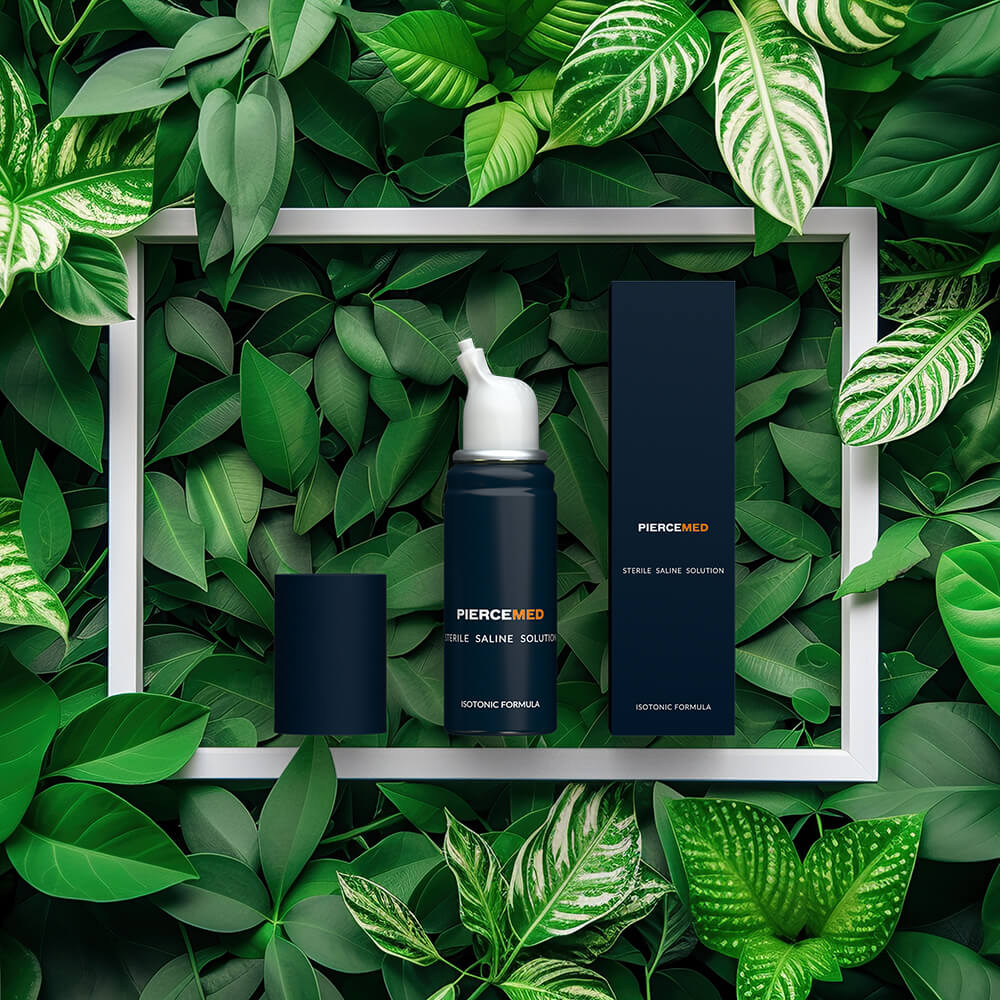 Image of PIERCEMED wholesale piercing aftercare laying on green leafs